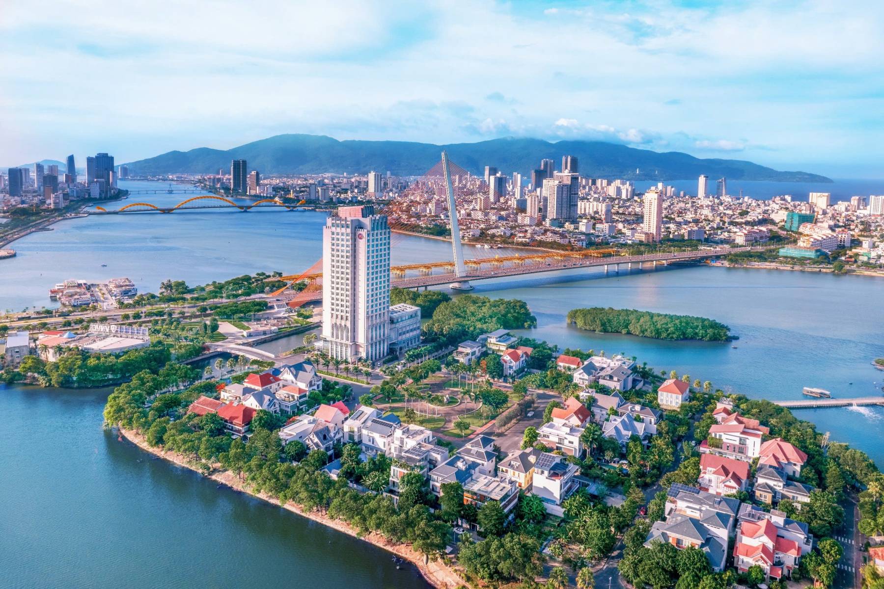 Grand Mercure Danang hotel on Green Island beside the Han River, with eight pickleball courts next door