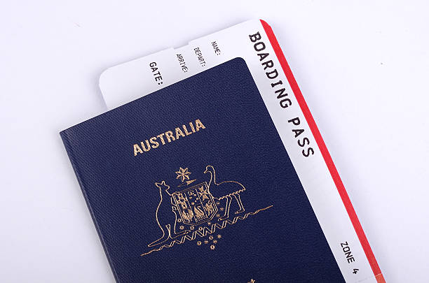 An Australian passport with a printed Vietnam e-visa and a boarding pass on a table
