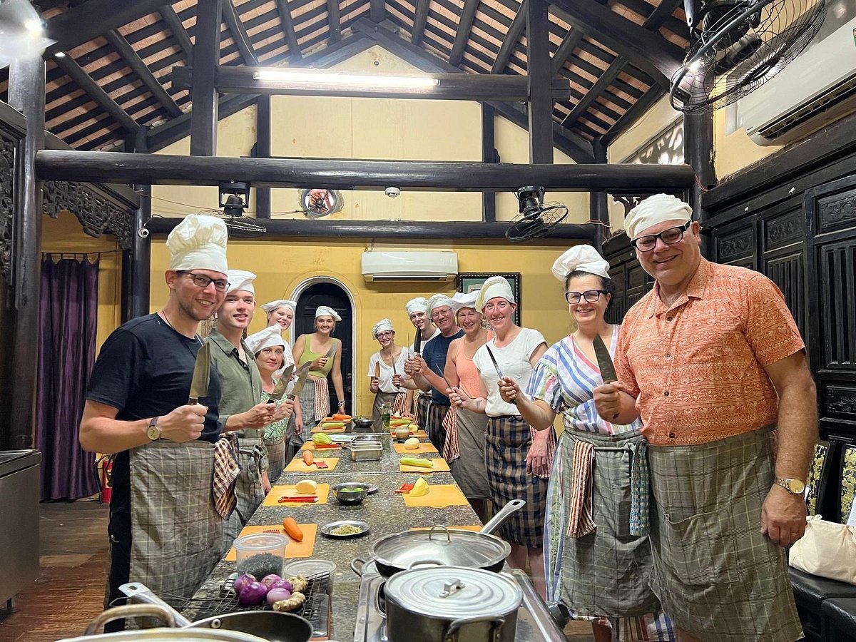 A couple at a cooking class in Hoi An, one partner not a pickleball player