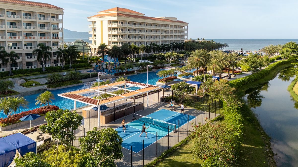 A beach resort in Da Nang with a swimming pool and its own pickleball court