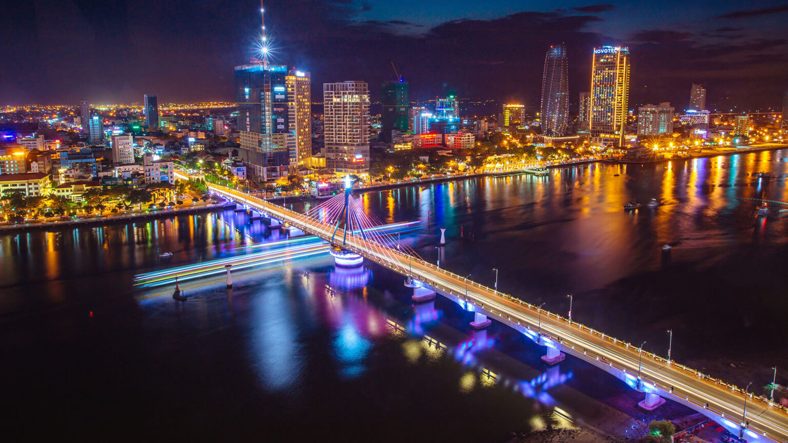 The Han River and the Da Nang skyline at dusk, with the bridges lit up
