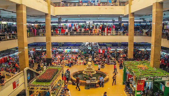 The busy multi-level interior of Dong Xuan Market in Hanoi Old Quarter