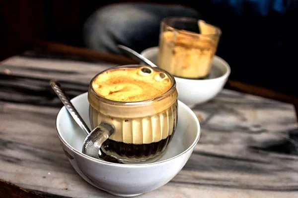 Vietnamese iced coffee served at a courtside cafe counter after a morning pickleball session