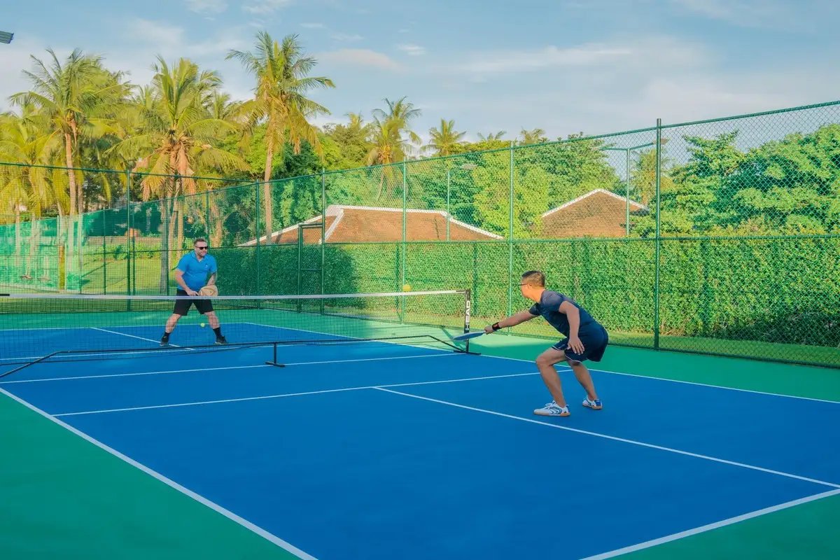 A pickleball court beside the tennis courts at Four Seasons The Nam Hai resort near Hoi An