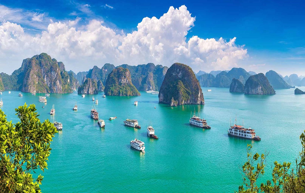 An aerial view of limestone islands rising from the water in Ha Long Bay