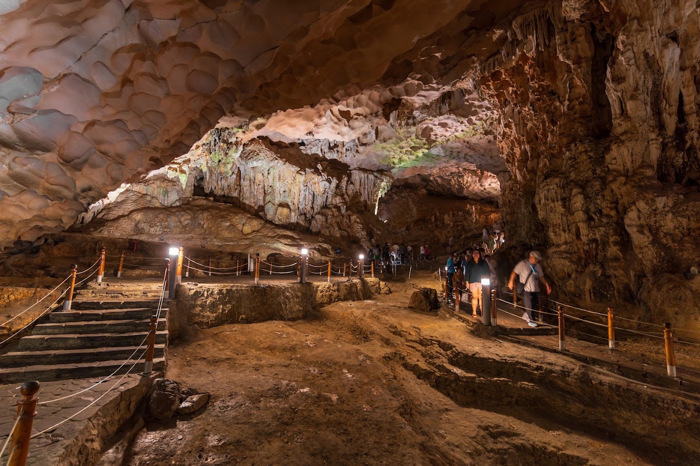 Stone steps and walkways inside Sung Sot Cave in Ha Long Bay