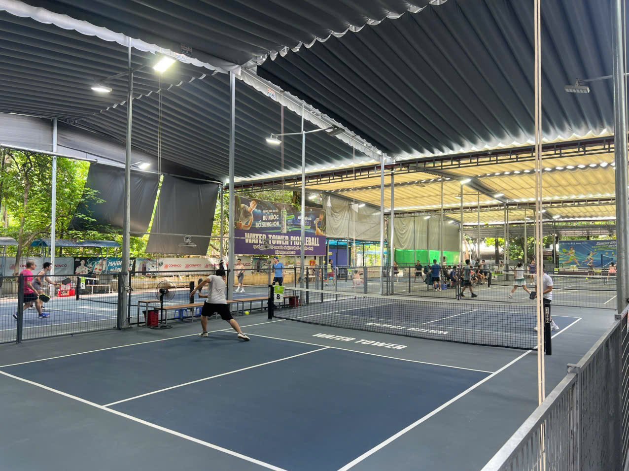 Local players filling several pickleball courts in Hanoi in the early morning