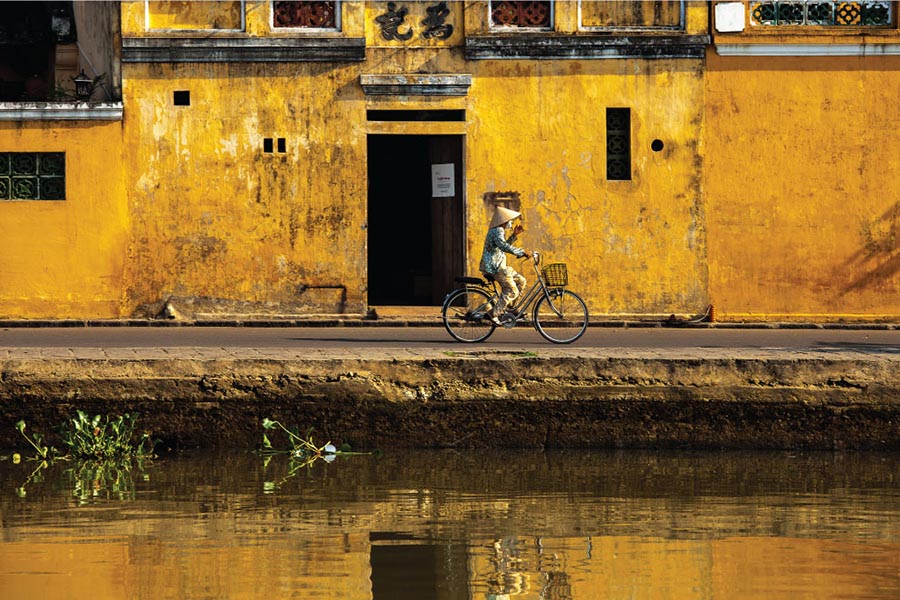 Yellow walls and bicycles on a street in Hoi An Old Town
