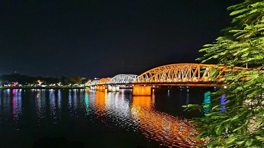 The Truong Tien Bridge lit up at night over the Perfume River in Hue