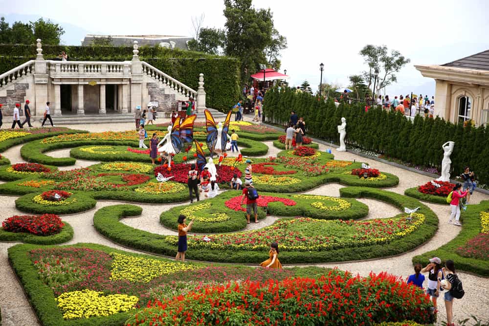 Formal French-style flower gardens with colourful beds and paths at Ba Na Hills