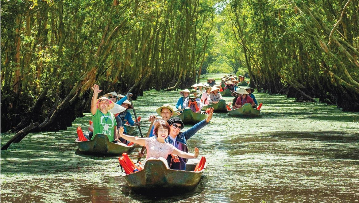 Boats on a high-water channel in the Mekong Delta, southern Vietnam, in November