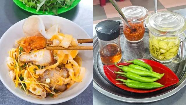 A bowl of mi quang noodles with shrimp, pork and herbs, a Da Nang specialty