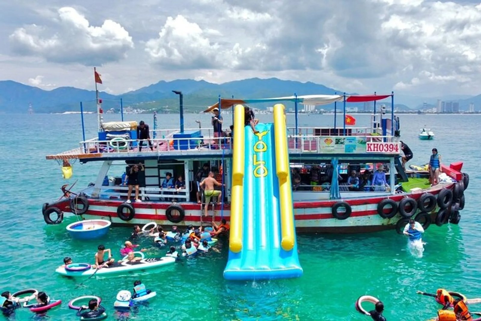 A boat in clear turquoise water off an island near Nha Trang