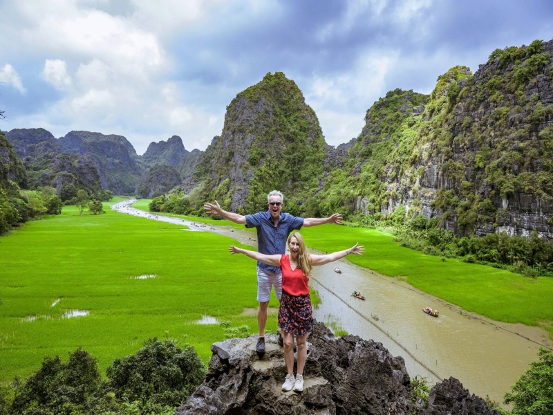 Young green rice fields below limestone karsts in Ninh Binh in March