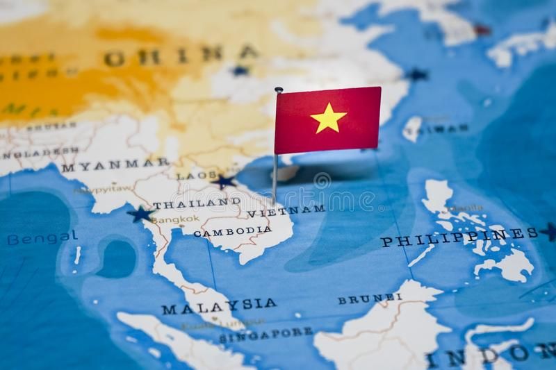 Planning a pickleball trip to Vietnam with a map, passport and paddle