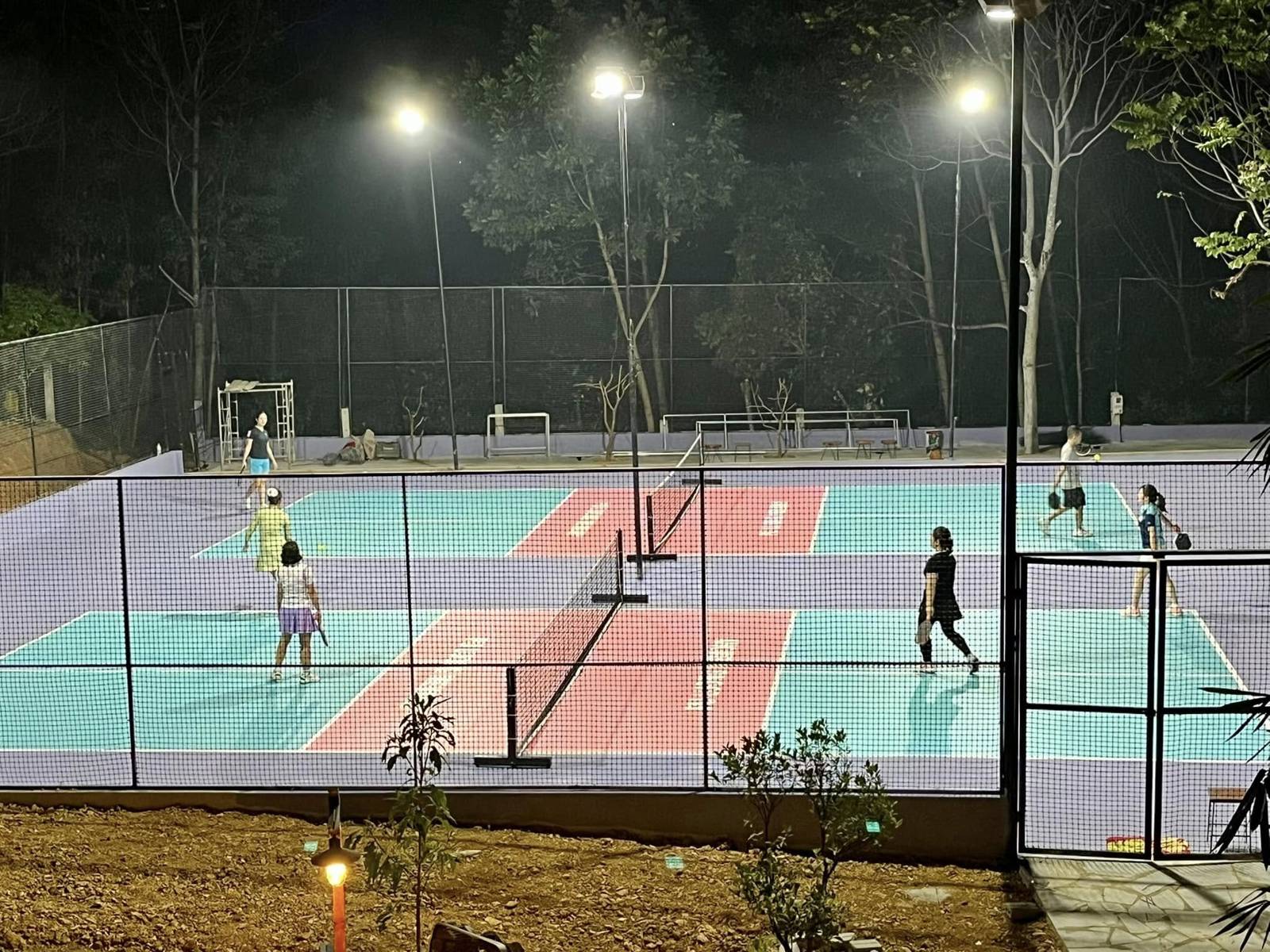A floodlit pickleball court in the hills of northern Vietnam, near Mai Chau and Pu Luong