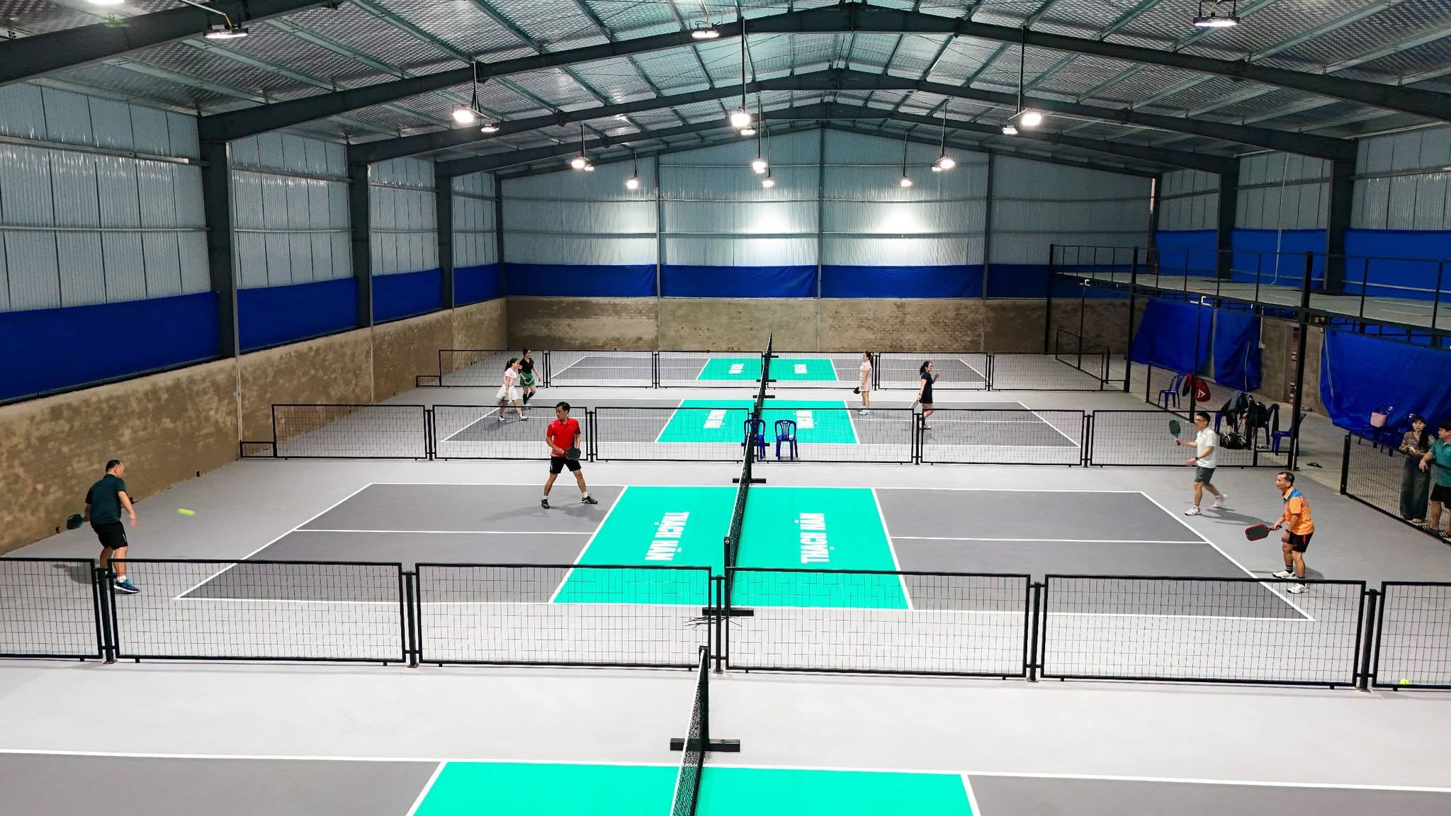 An outdoor pickleball court in central Vietnam in the early morning, before a DMZ day trip