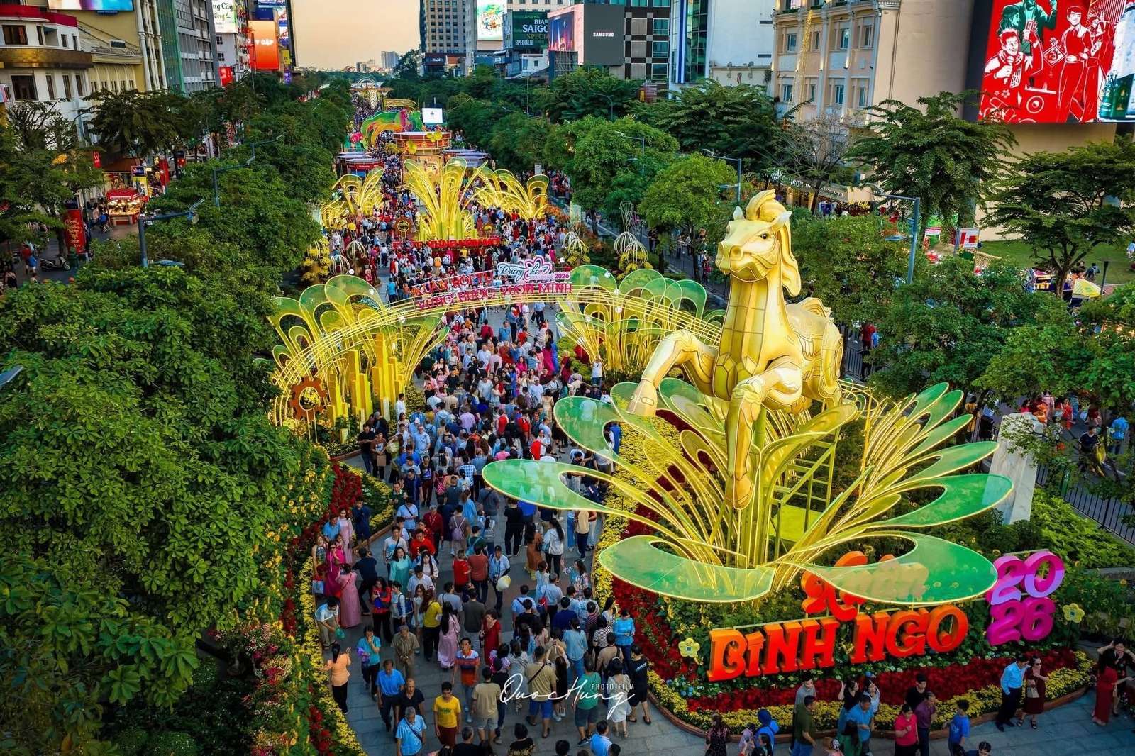 Crowds walking along the Nguyen Hue flower street displays in Ho Chi Minh City at Tet