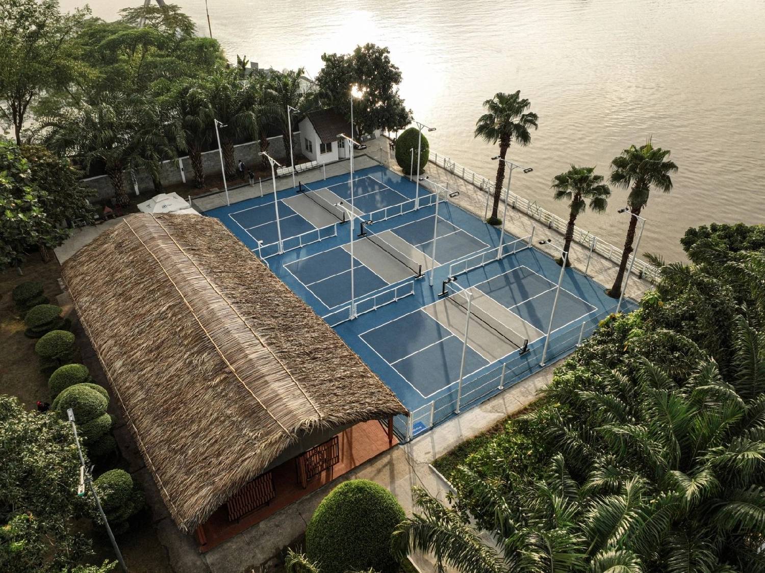 Players on a pickleball court in Thao Dien, Ho Chi Minh City, in the early morning