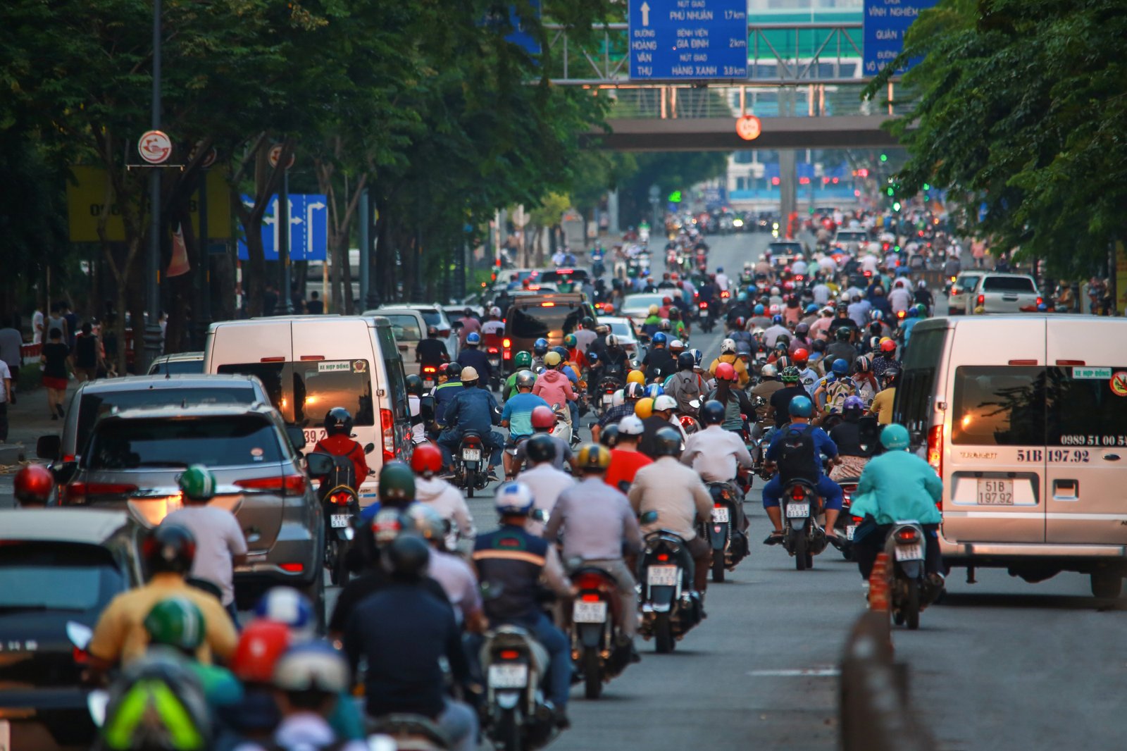 Motorbikes and street life on a busy street in Ho Chi Minh City