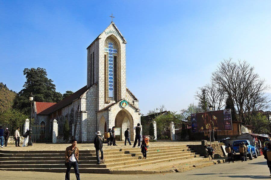 The stone church in the centre of Sapa town under a misty sky