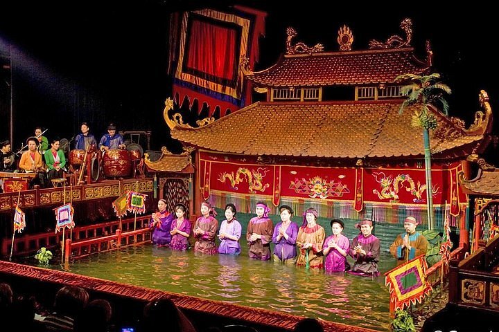 Wooden puppets dancing on the water at the Thang Long Water Puppet Theatre in Hanoi