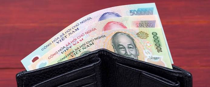 Vietnamese dong banknotes in an open wallet