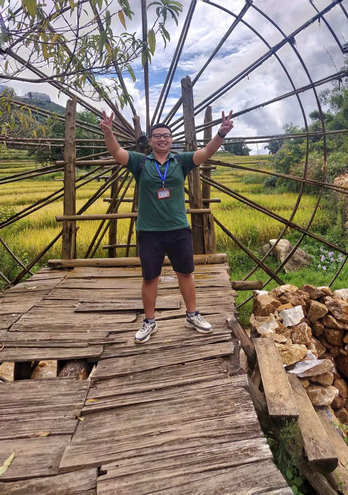 Travellers crossing a bamboo bridge in the countryside