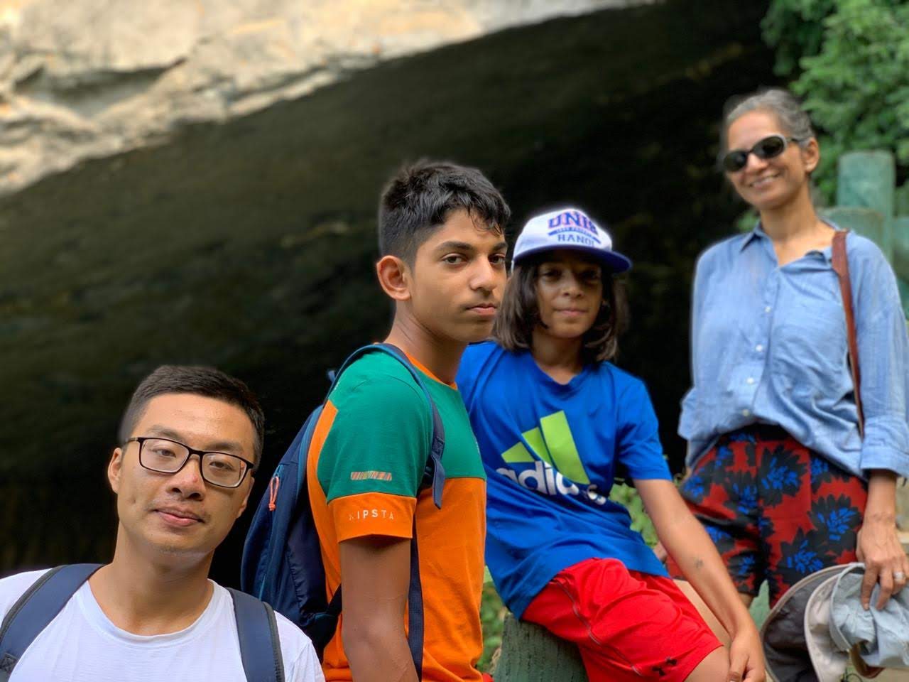 A family out hiking in the green hills