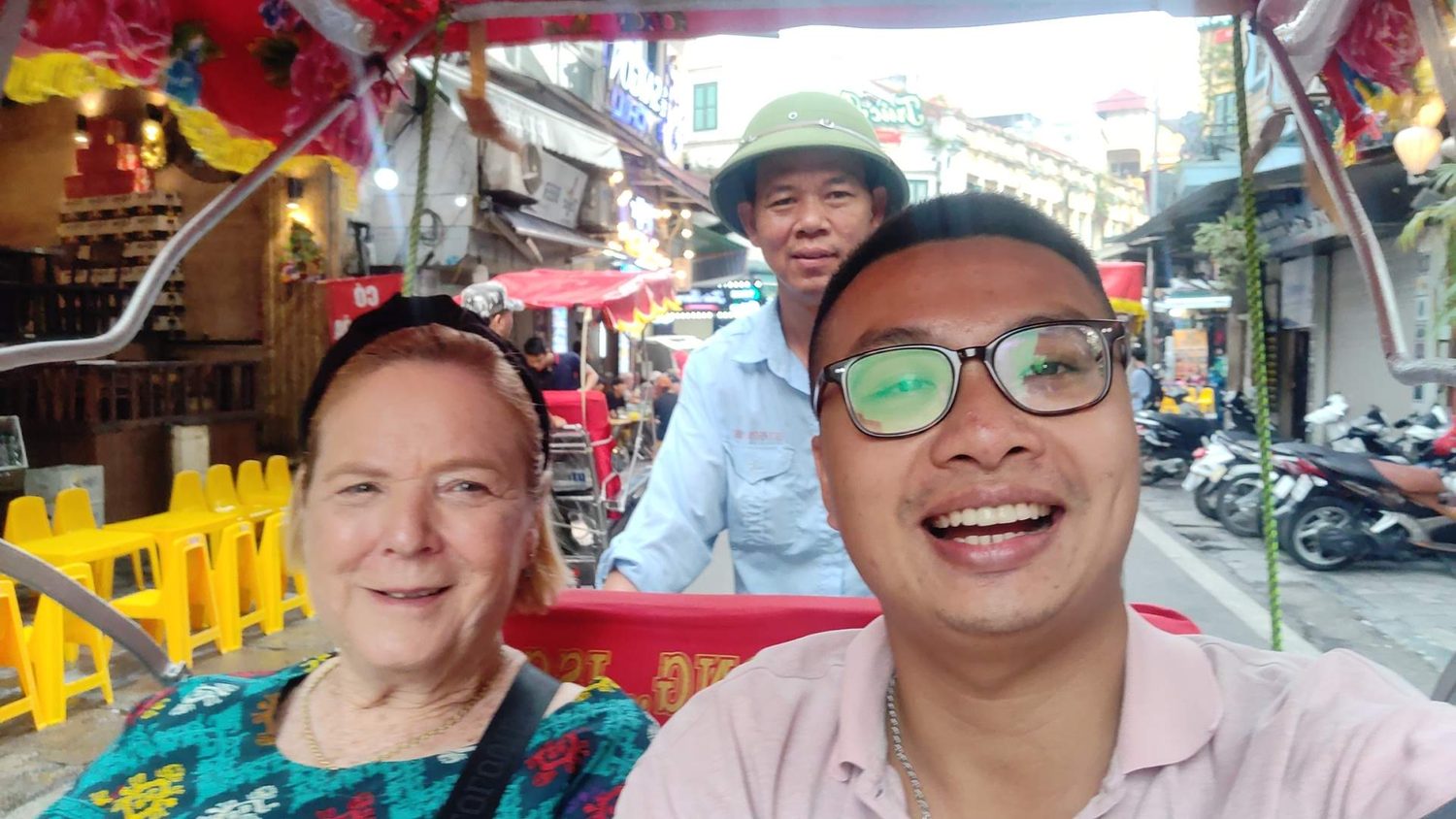Kevin and a traveller laughing on the street