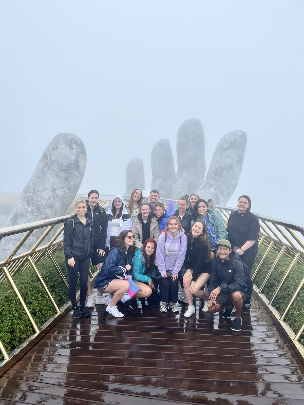 Guests in front of the giant stone hands of the Golden Bridge, Ba Na Hills