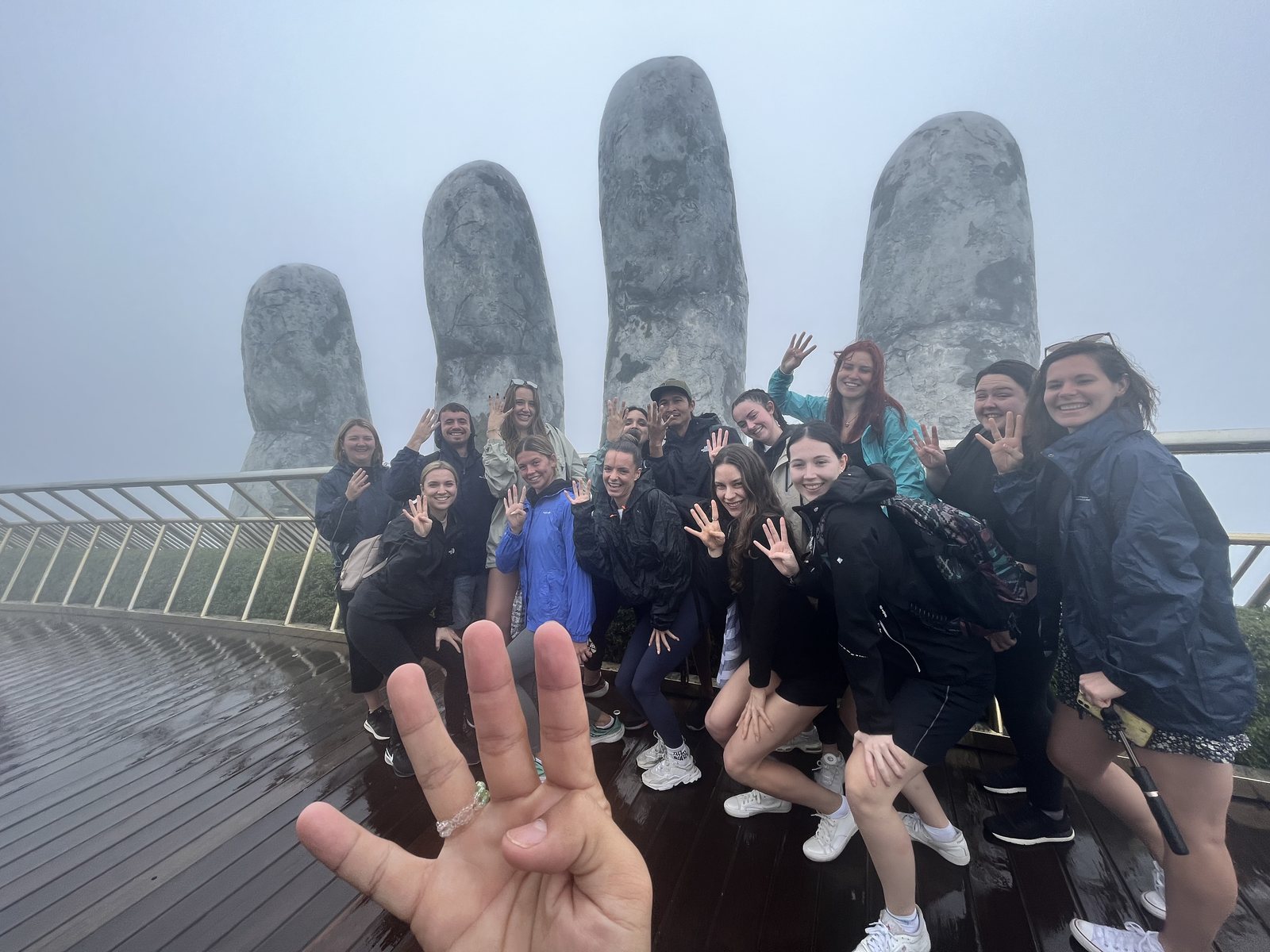 Our group on the Golden Bridge at Ba Na Hills on a misty morning