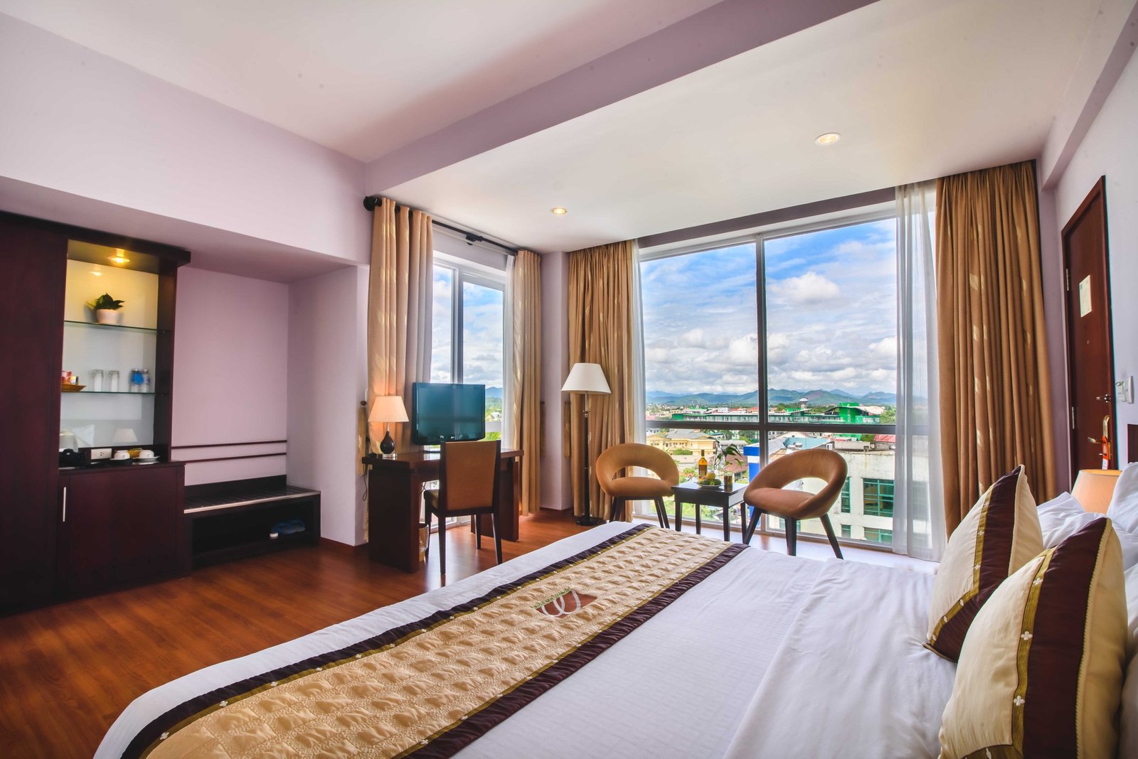A hotel room with a view towards the Perfume River in Hue